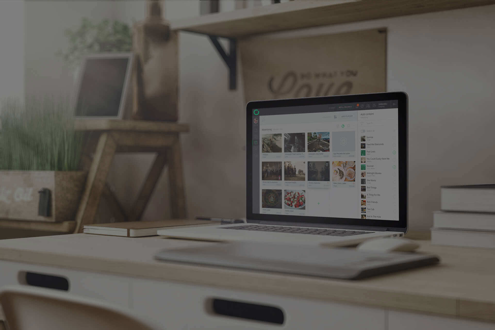 macbook with digital signage